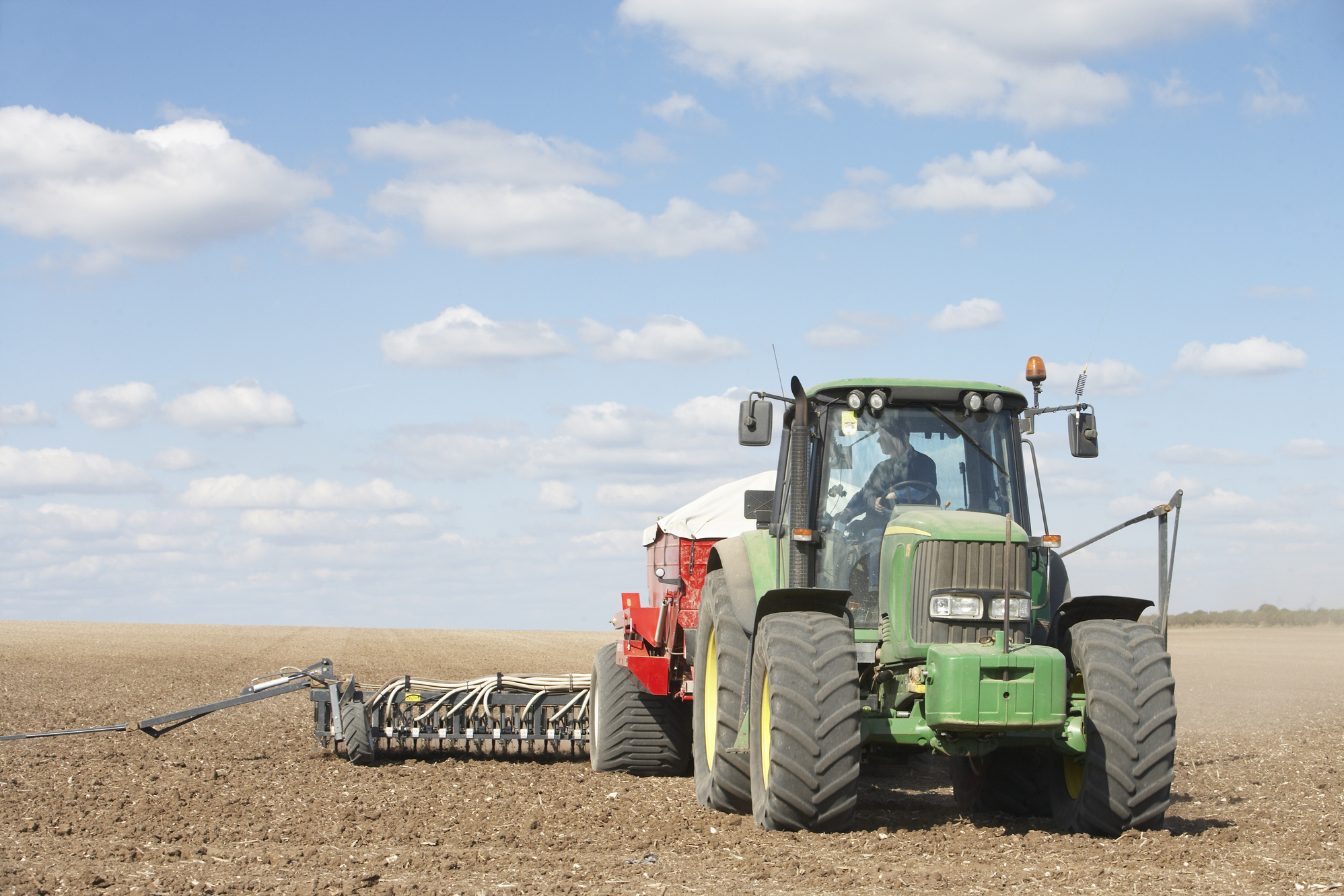 Tractor Planting Seed in Field